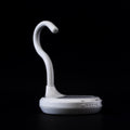 AiryFairy automated candle extinguisher, a white safety device designed to prevent candle fires, elegantly styled.