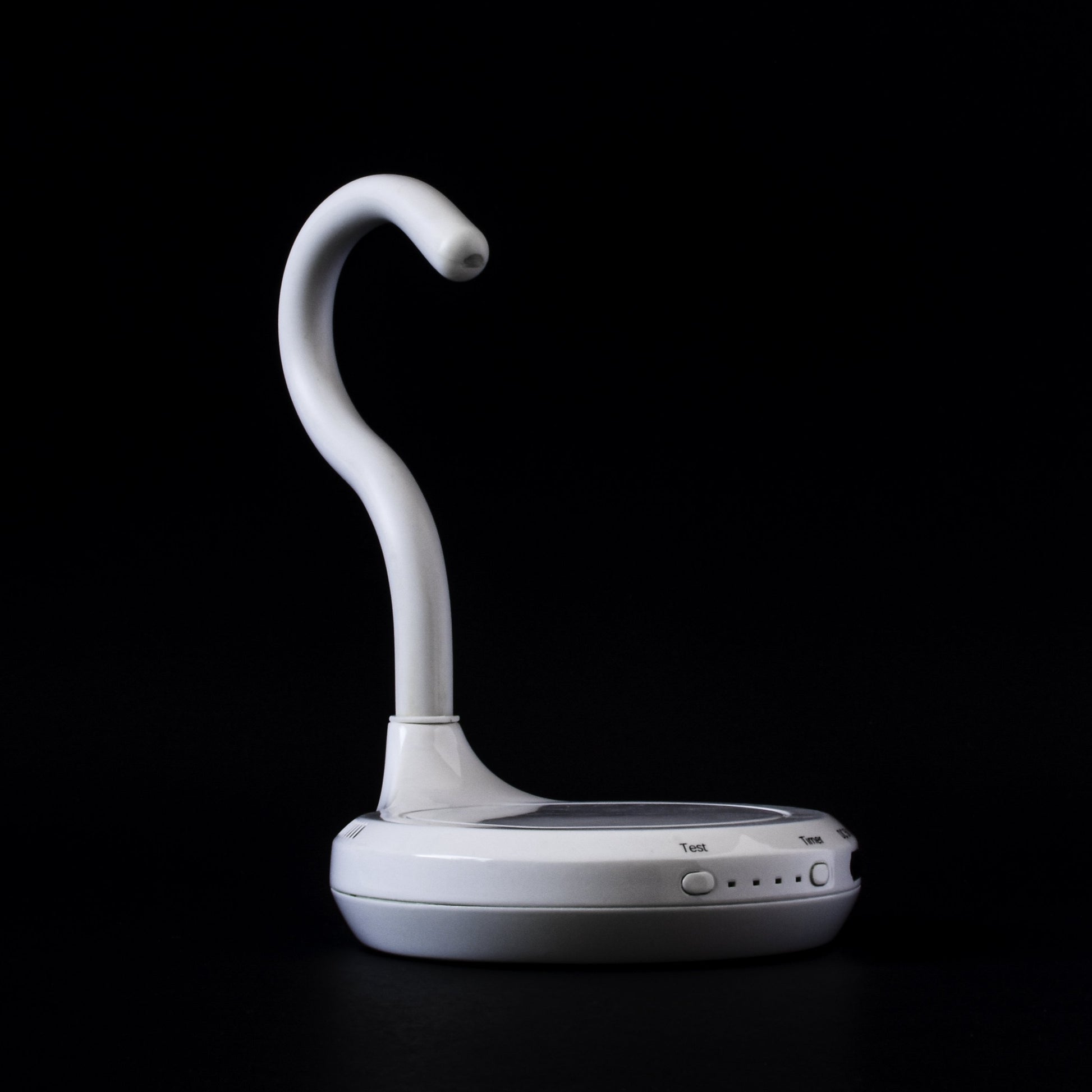 AiryFairy automated candle extinguisher, a white safety device designed to prevent candle fires, elegantly styled.