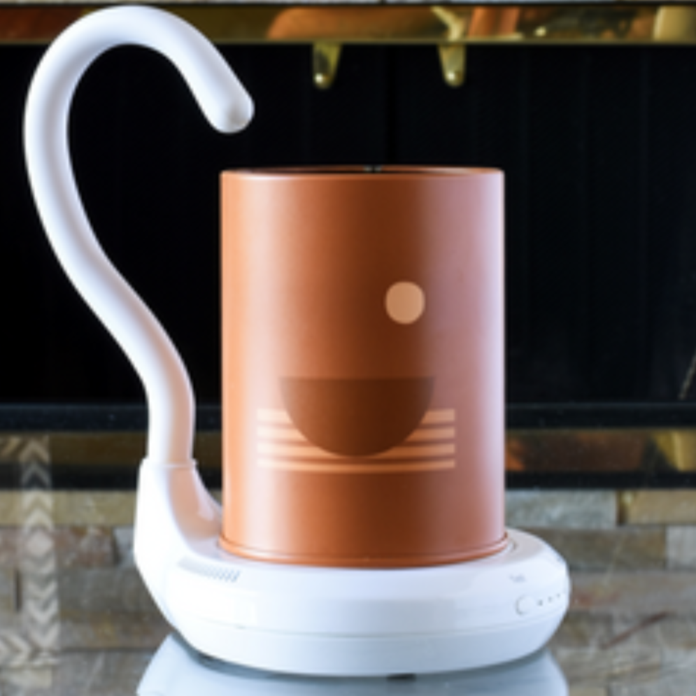 AiryFairy Automated Candle Extinguisher beside a stylish candle, showcasing safety and elegance for home use.
